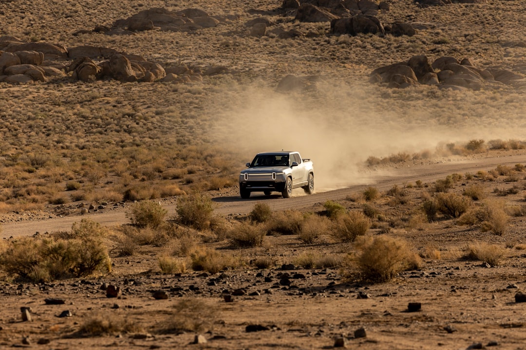 Mizuho Cuts Rivian to Underperform, Trims Target to $10 on Softer 2026 Outlook