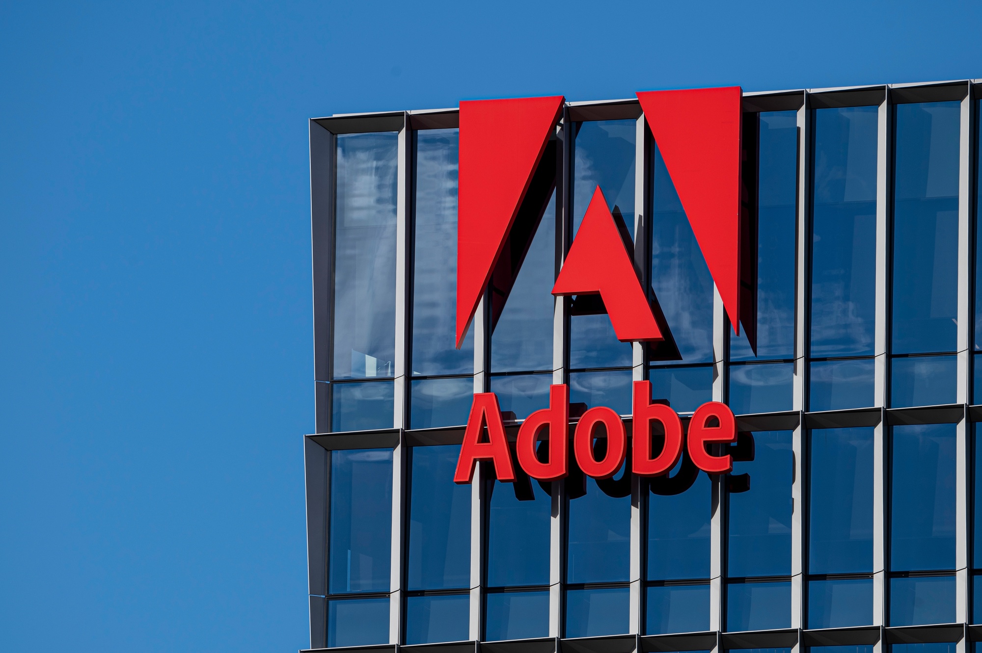 Adobe Inc. (NASDAQ:ADBE) Surpasses Q3 Earnings and Revenue Estimates